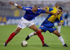 French forward Thierry Henry is challeng